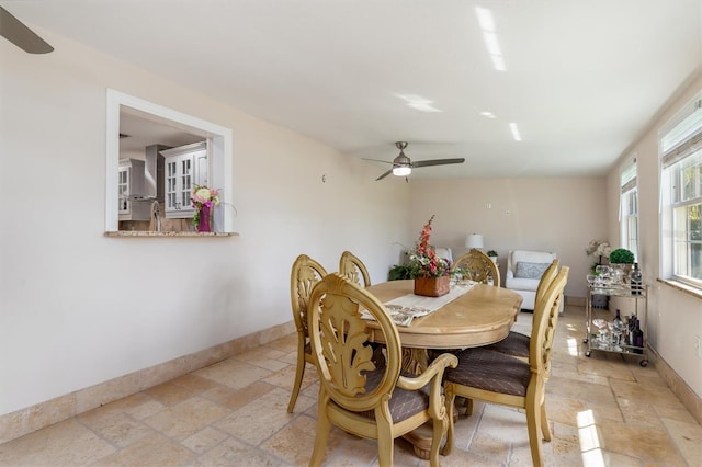 123 Annapolis Ln, Rotonda West, FL 33947 - dining room featuring stone tile flooring and ceiling fan