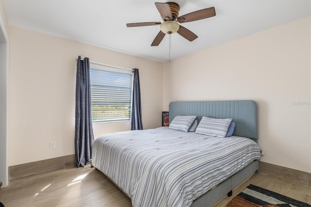 123 Annapolis Ln, Rotonda West, FL 33947 - bedroom with a ceiling fan and baseboards