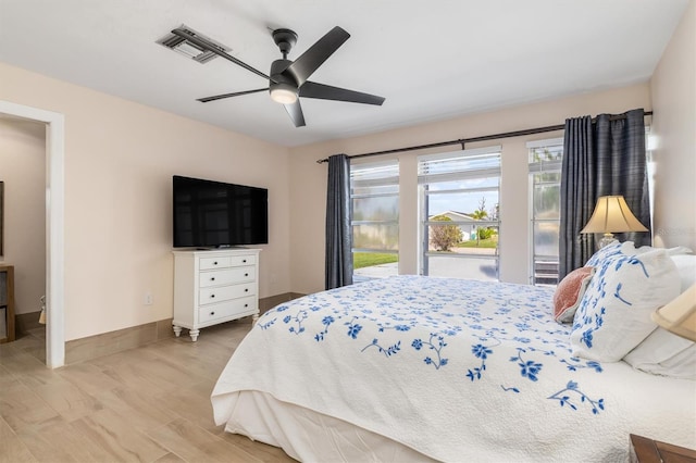 123 Annapolis Ln, Rotonda West, FL 33947 - bedroom featuring light wood-style flooring and a ceiling fan