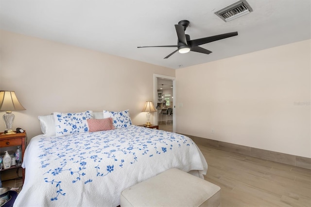 123 Annapolis Ln, Rotonda West, FL 33947 - bedroom featuring wood finished floors and a ceiling fan