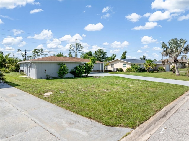 123 Annapolis Ln, Rotonda West, FL 33947 - ranch-style house featuring driveway and a front lawn