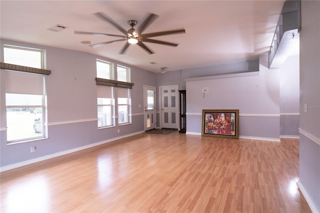 10724 SW Park Ave, Arcadia, FL 34269 - unfurnished living room with ceiling fan and light wood-type flooring
