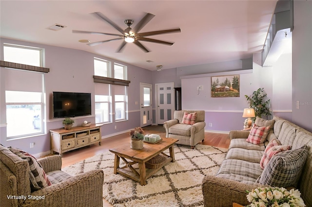 10724 SW Park Ave, Arcadia, FL 34269 - living area with light wood-style floors, healthy amount of natural light, and a ceiling fan