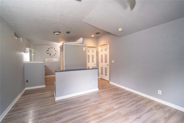 10724 SW Park Ave, Arcadia, FL 34269 - empty room with wood finished floors, a textured ceiling, and recessed lighting
