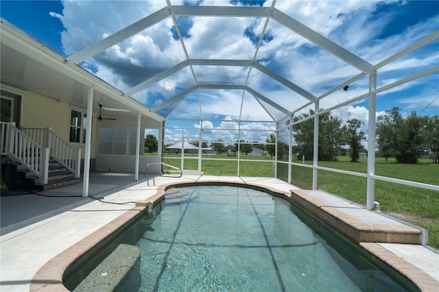 10724 SW Park Ave, Arcadia, FL 34269 - swimming pool featuring a patio area, a lawn, a ceiling fan, and glass enclosure