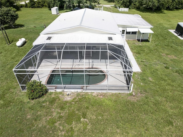 10724 SW Park Ave, Arcadia, FL 34269 - back of property featuring a patio area, an outdoor pool, a lanai, and a lawn