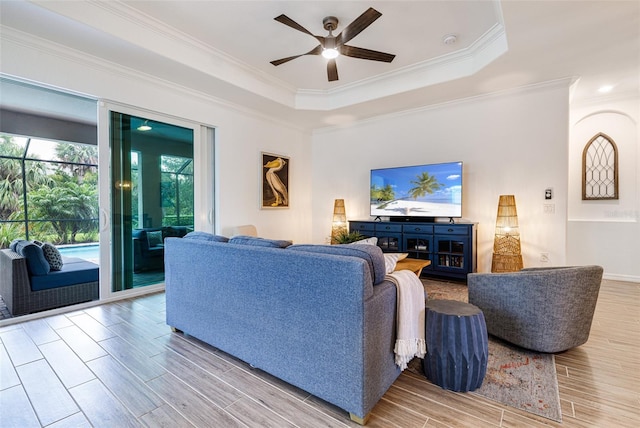 14684 Cherry Blossom Way, Punta Gorda, FL 33955 - living room with a ceiling fan, crown molding, a tray ceiling, and wood finished floors