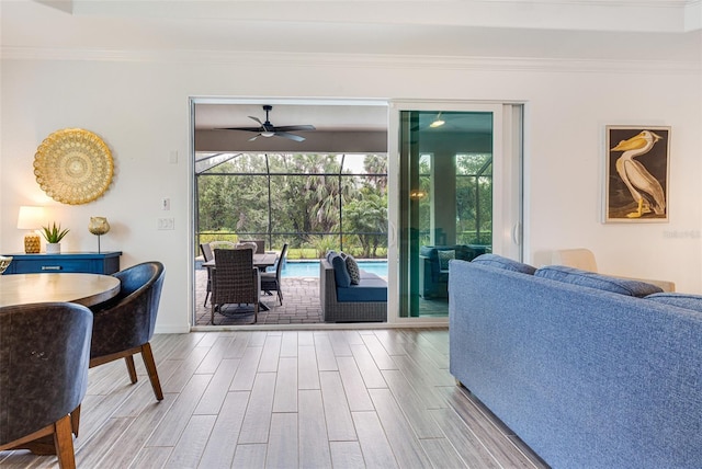 14684 Cherry Blossom Way, Punta Gorda, FL 33955 - living room with wood finished floors, crown molding, healthy amount of natural light, and ceiling fan