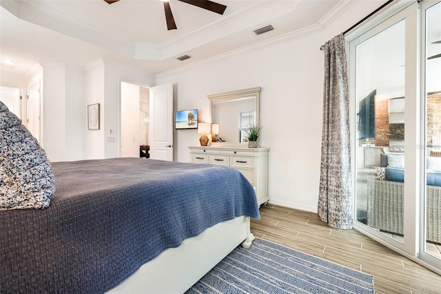 14684 Cherry Blossom Way, Punta Gorda, FL 33955 - bedroom featuring wood finish floors, a raised ceiling, crown molding, and a ceiling fan