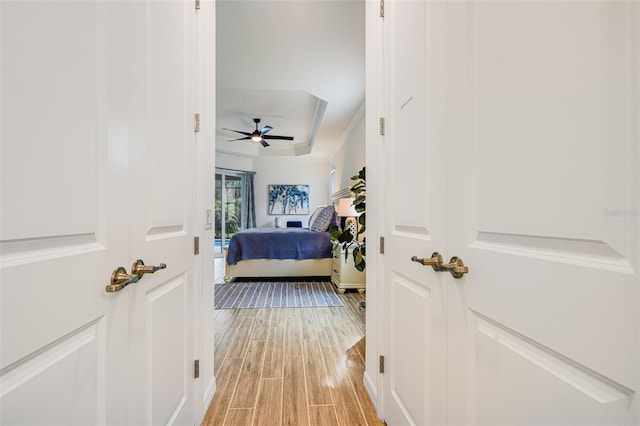 14684 Cherry Blossom Way, Punta Gorda, FL 33955 - bedroom with a tray ceiling and light wood-style floors