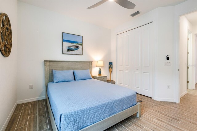 14684 Cherry Blossom Way, Punta Gorda, FL 33955 - bedroom featuring wood finish floors, a closet, and a ceiling fan