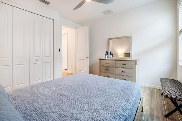 14684 Cherry Blossom Way, Punta Gorda, FL 33955 - bedroom with wood finished floors, a closet, and a ceiling fan