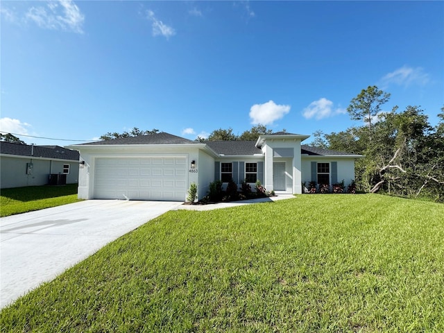 4863 Las Almanos Ave, North Port, FL 34288 - single story home featuring an attached garage, driveway, a front lawn, and stucco siding