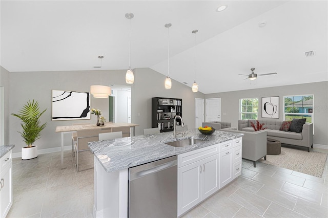 4863 Las Almanos Ave, North Port, FL 34288 - kitchen with dishwasher, lofted ceiling, ceiling fan, white cabinets, and light stone counters