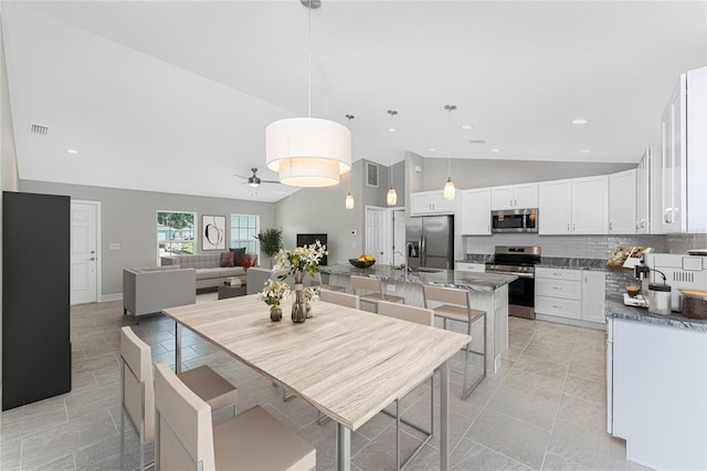 4863 Las Almanos Ave, North Port, FL 34288 - dining area featuring ceiling fan, recessed lighting, and high vaulted ceiling