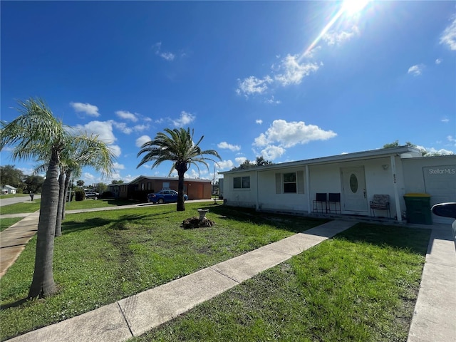 2336 Picnic St, Port Charlotte, FL 33952 - ranch-style house with a front lawn and stucco siding