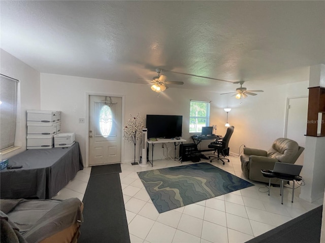2336 Picnic St, Port Charlotte, FL 33952 - living room featuring a ceiling fan, an office area, light tile patterned flooring, and a textured ceiling