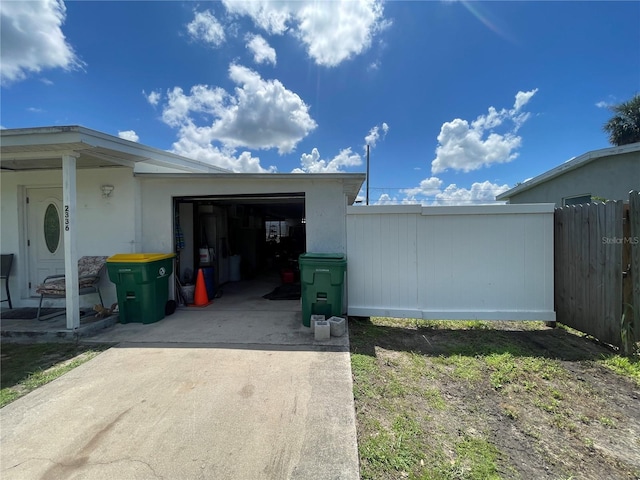 2336 Picnic St, Port Charlotte, FL 33952 - view of side of property with driveway and a garage