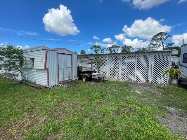 2336 Picnic St, Port Charlotte, FL 33952 - view of grassy yard featuring a shed