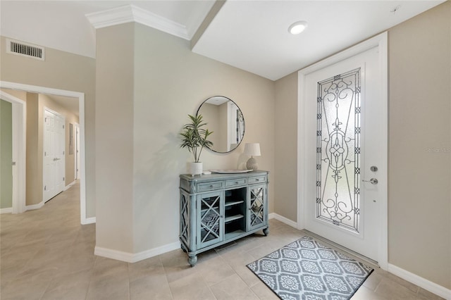 12425 Ghiberti Cir Unit 101, Venice, FL 34293 - foyer entrance with light tile patterned flooring and ornamental molding