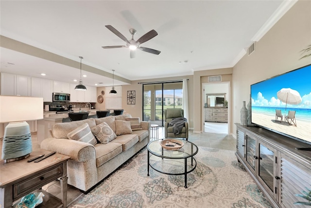 12425 Ghiberti Cir Unit 101, Venice, FL 34293 - living area with crown molding, recessed lighting, and ceiling fan