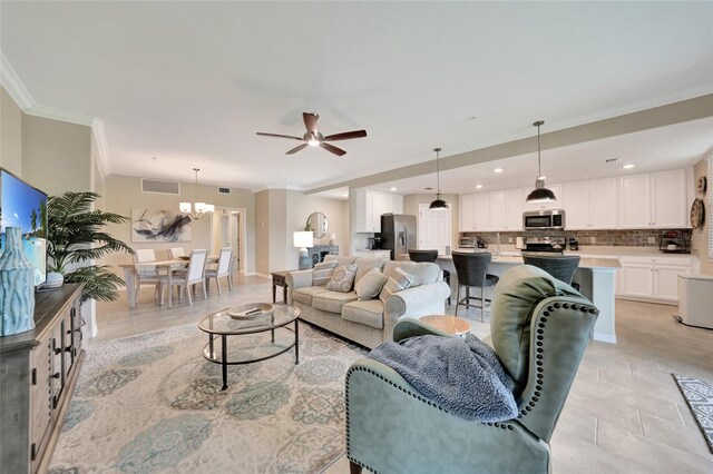 12425 Ghiberti Cir Unit 101, Venice, FL 34293 - living room featuring ceiling fan, crown molding, a chandelier, recessed lighting, and light tile patterned floors
