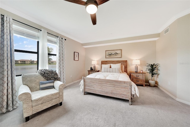12425 Ghiberti Cir Unit 101, Venice, FL 34293 - carpeted bedroom featuring crown molding, a ceiling fan, and a water view