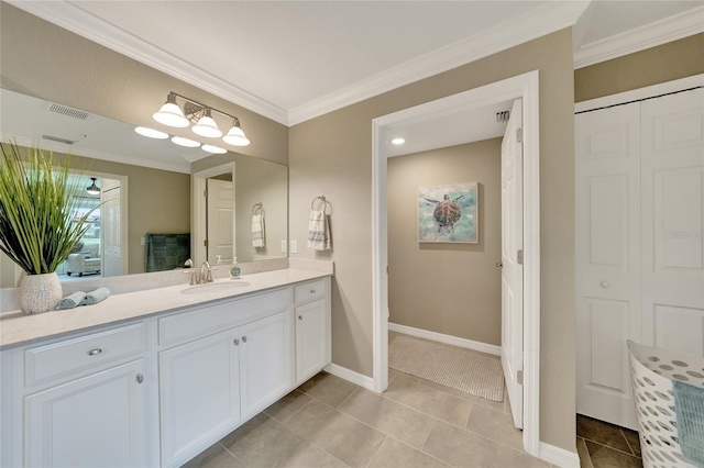 12425 Ghiberti Cir Unit 101, Venice, FL 34293 - bathroom featuring ornamental molding, vanity, tile patterned floors, and a closet
