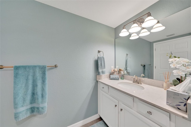 12425 Ghiberti Cir Unit 101, Venice, FL 34293 - bathroom featuring vanity and baseboards