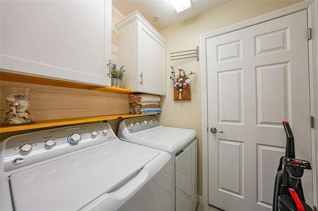 12425 Ghiberti Cir Unit 101, Venice, FL 34293 - washroom with washer and clothes dryer and cabinet space