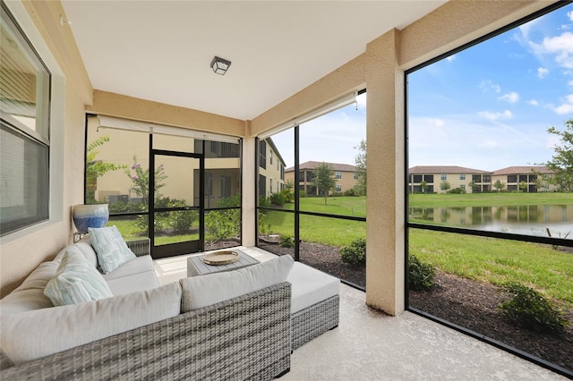 12425 Ghiberti Cir Unit 101, Venice, FL 34293 - sunroom / solarium featuring an outdoor living space and a water view