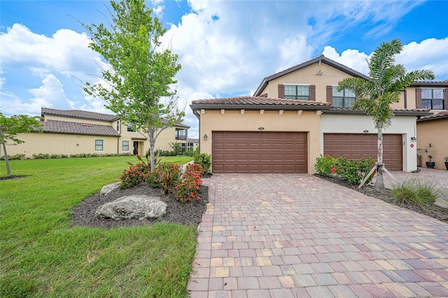 12425 Ghiberti Cir Unit 101, Venice, FL 34293 - view of front of house featuring stucco siding, a front lawn, decorative driveway, and a tile roof