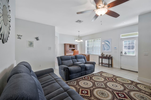 3116 SW 16th Pl, Cape Coral, FL 33914 - living area featuring light tile patterned floors, a chandelier, and a ceiling fan