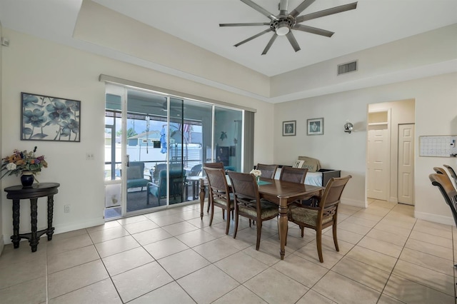 3116 SW 16th Pl, Cape Coral, FL 33914 - dining room with ceiling fan, light tile patterned floors, and a tray ceiling