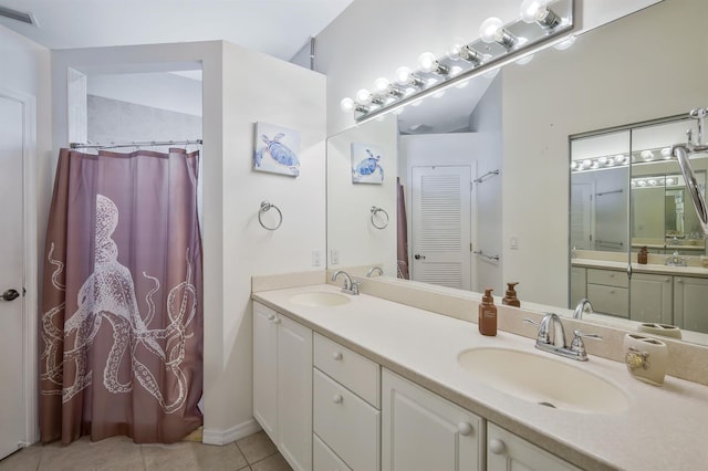 3116 SW 16th Pl, Cape Coral, FL 33914 - bathroom featuring double vanity, tile patterned floors, and a shower with curtain