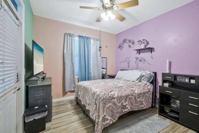 3116 SW 16th Pl, Cape Coral, FL 33914 - bedroom with light wood-type flooring and ceiling fan