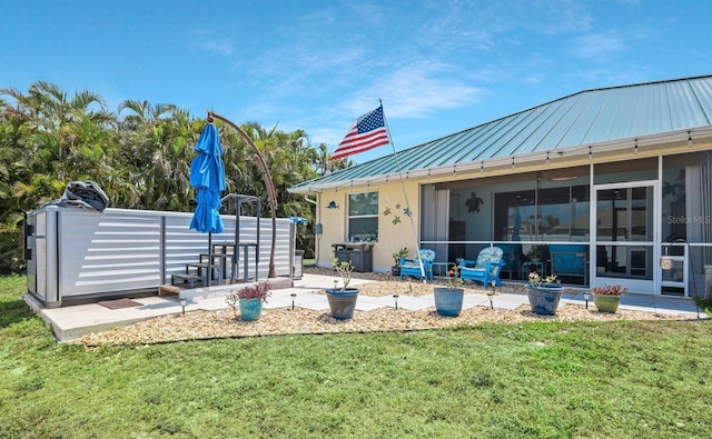3116 SW 16th Pl, Cape Coral, FL 33914 - back of property featuring a standing seam roof, a metal roof, a yard, and stucco siding