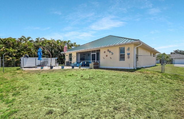 3116 SW 16th Pl, Cape Coral, FL 33914 - rear view of property with a sunroom, a standing seam roof, a metal roof, and stucco siding