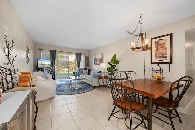 311 Garvin St Unit 301B, Punta Gorda, FL 33950 - dining room featuring light tile patterned flooring and a chandelier