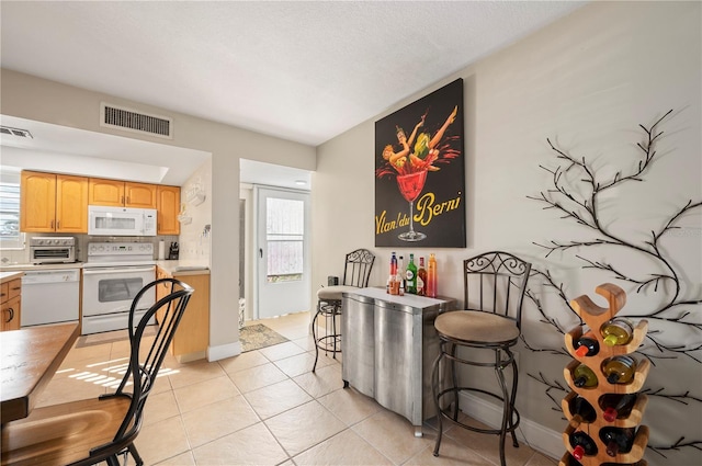 311 Garvin St Unit 301B, Punta Gorda, FL 33950 - dining space with plenty of natural light and light tile patterned floors