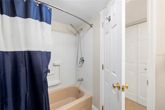 311 Garvin St Unit 301B, Punta Gorda, FL 33950 - bathroom with shower / tub combo with curtain, a textured ceiling, and a closet