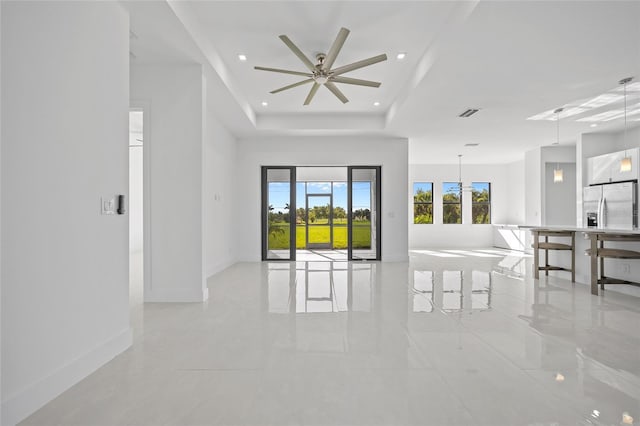 16322 Nogales Ct, Punta Gorda, FL 33955 - empty room featuring light tile patterned floors, recessed lighting, a raised ceiling, and a ceiling fan