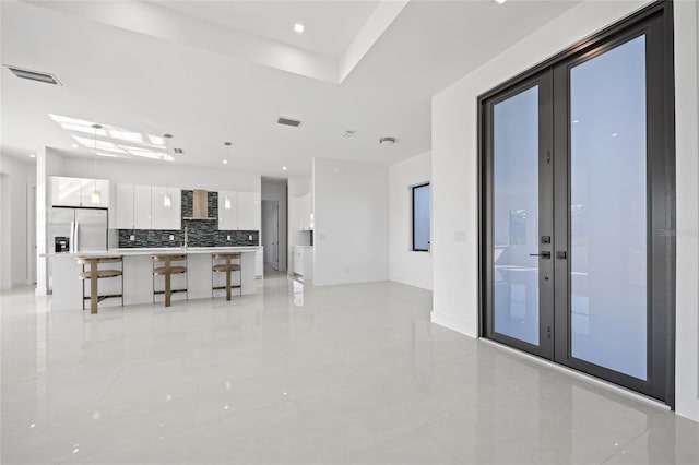 16322 Nogales Ct, Punta Gorda, FL 33955 - living area featuring light tile patterned floors, french doors, and recessed lighting