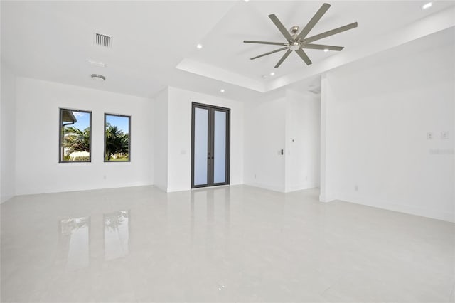 16322 Nogales Ct, Punta Gorda, FL 33955 - unfurnished room with a ceiling fan, recessed lighting, and a tray ceiling