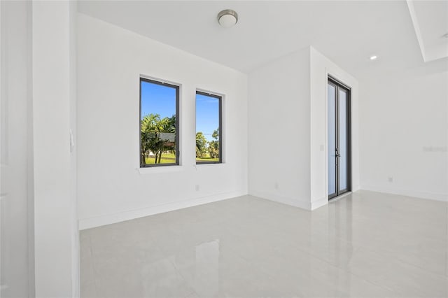 16322 Nogales Ct, Punta Gorda, FL 33955 - tiled empty room featuring baseboards