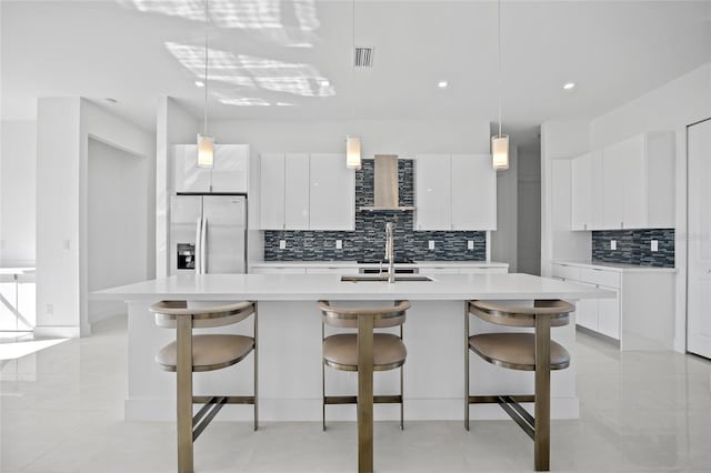 16322 Nogales Ct, Punta Gorda, FL 33955 - kitchen with stainless steel fridge with ice dispenser, modern cabinets, light countertops, decorative backsplash, and white cabinets