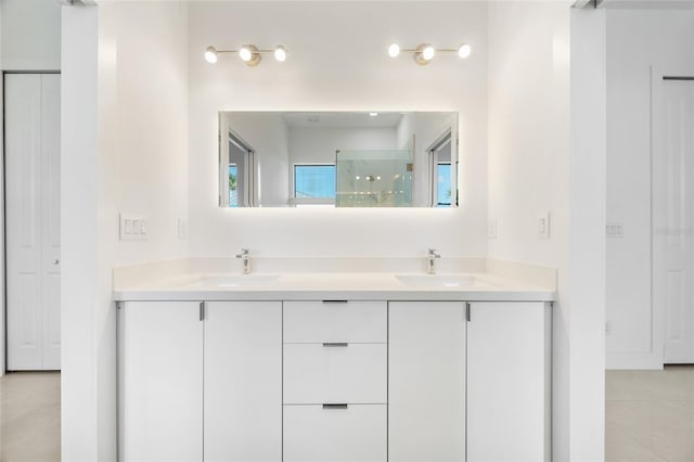 16322 Nogales Ct, Punta Gorda, FL 33955 - bathroom featuring double vanity and a shower