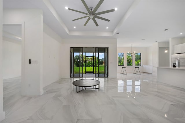 17200 Mint Ln, Punta Gorda, FL 33955 - living area with ceiling fan, light marble finish floors, a tray ceiling, and recessed lighting