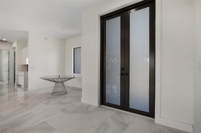 17200 Mint Ln, Punta Gorda, FL 33955 - corridor featuring light marble finish flooring and baseboards