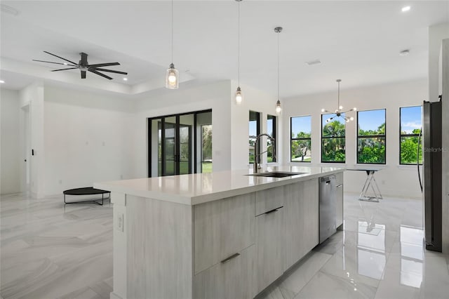 17200 Mint Ln, Punta Gorda, FL 33955 - kitchen with modern cabinets, dishwasher, light countertops, a large island with sink, and open floor plan